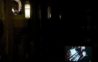 Craig Cramer's live performance showing his image projected on a large screen in the nave of Our Lady of Refuge so the audience can see him play