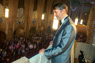Olivier Latry takes a bow after his recital on the organ at Our Lady of Refuge in Brooklyn.